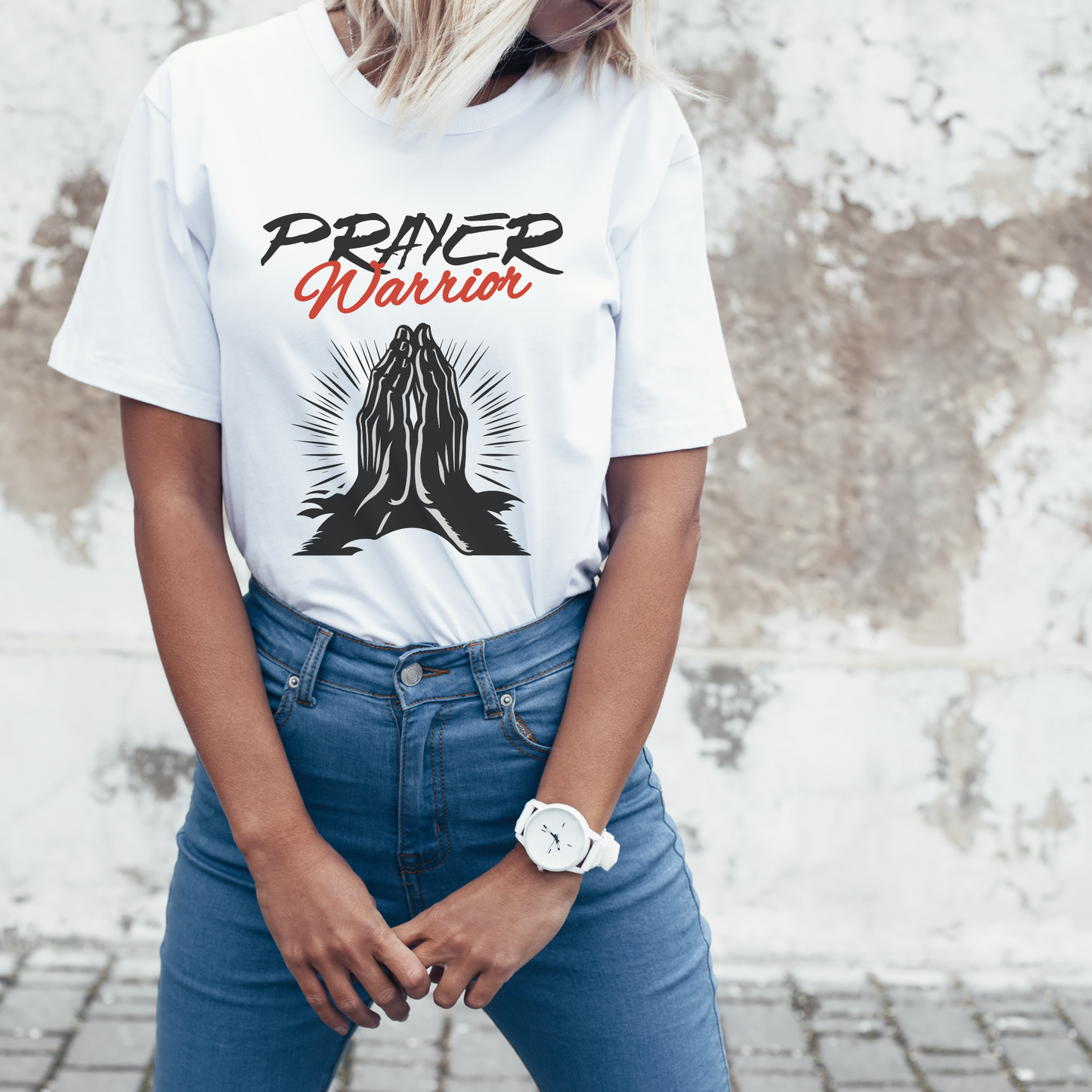 women wearing a prayer warrior tshirt with praying hands on the front